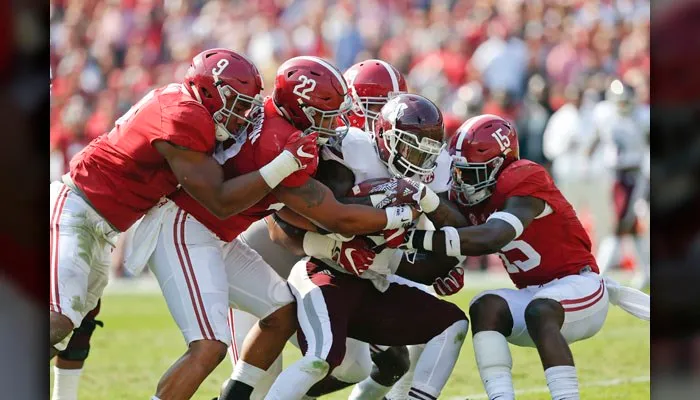 The Alabama defensive line does that thing it does to a Mississippi State running back earlier this season. (Source: AP/Brynn Anderson)