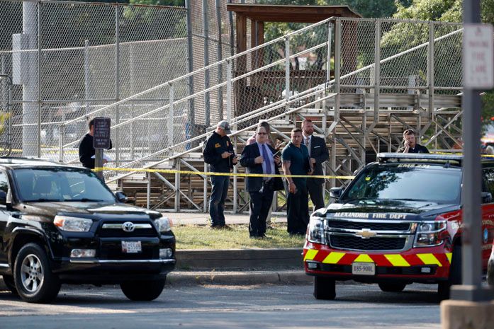 Law enforcement officers investigate the scene of a shooting near a baseball field in Alexandria, Va., Wednesday, June 14, 2017, where House Majority Whip Steve Scalise of La. was shot at a Congressional baseball practice. (AP Photo/Alex Brandon)