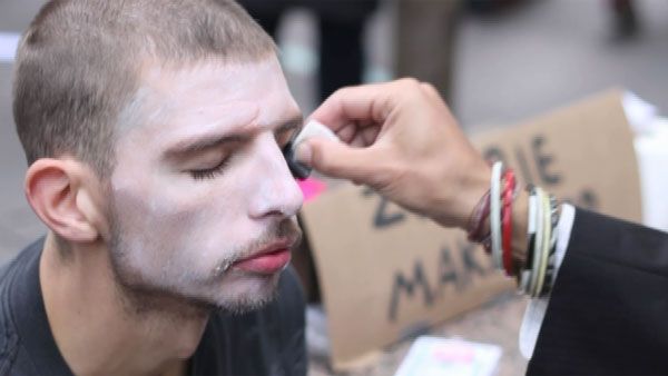 Protesters received "zombie makeovers" Monday for a demonstration against corporate greed. (Source: CNN)