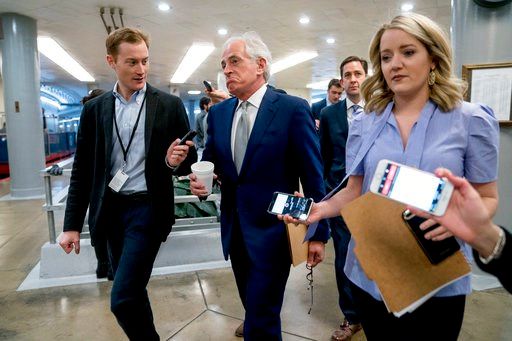 (AP Photo/Andrew Harnik). Sen. Bob Corker, R-Tenn., reacts as he speaks to reporters as he walks towards the Senate as Congress moves closer to the funding deadline to avoid a government shutdown on Capitol Hill in Washington, Thursday, Jan. 18, 2018.
