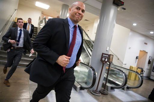 (AP Photo/J. Scott Applewhite). Sen. Cory Booker, D-N.J., runs to catch a subway car as he returns to his office on Capitol Hill as Congress moves closer to the deadline to avoid a government shutdown, in Washington, Thursday, Jan. 18, 2018.