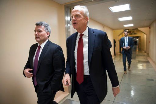 (AP Photo/J. Scott Applewhite). Sen. Cory Gardner, R-Colo., left, and Sen. Jerry Moran, R-Kan., return to their offices on Capitol Hill as Congress moves closer to the deadline to avoid a government shutdown, in Washington, Thursday, Jan. 18, 2018.