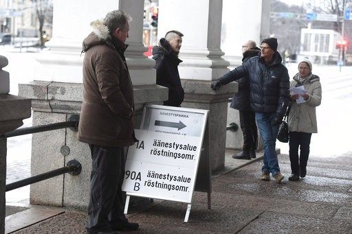 (Heikki Saukkomaa/Lehtikuva via AP). People wait to vote during the presidential election at the Helsinki City Hall in Helsinki, Finland, Sunday, Jan. 28, 2018. Finns are voting for a new president in the election that's expected to see the highly popu...