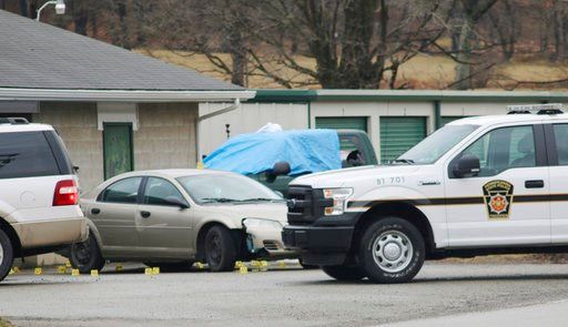 (Michael Palm /Herald-Standard via AP). Evidence markers sit on the scene of a fatal shooting at a car wash in Melcroft, Pa., Sunday, Jan. 28, 2018.