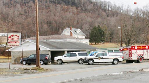 (Michael Palm/Herald-Standard via AP). Officers work on the scene of a fatal shooting at a car wash in Melcroft, Pa., Sunday, Jan. 28, 2018.