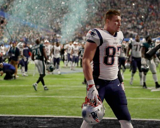 (AP Photo/Chris O'Meara). New England Patriots' Rob Gronkowski walks off the field after the NFL Super Bowl 52 football game against the Philadelphia Eagles Sunday, Feb. 4, 2018, in Minneapolis. The Eagles won 41-33.