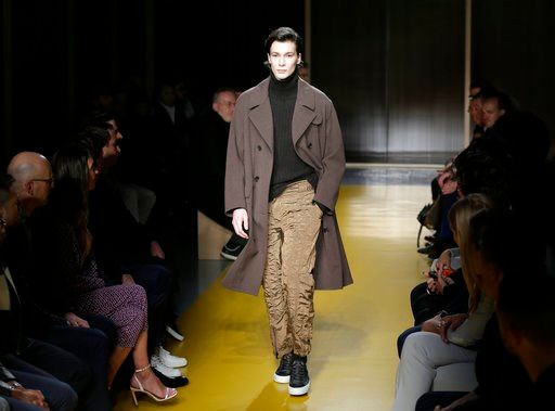 (AP Photo/Seth Wenig). A model walks the runway at a Hugo Boss fashion show during Fashion Week in New York, Wednesday, Feb. 7, 2018.