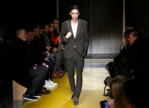 (AP Photo/Seth Wenig). A model walks the runway at a Hugo Boss fashion show during Fashion Week in New York, Wednesday, Feb. 7, 2018.