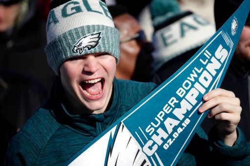 (AP Photo/Julio Cortez). A Philadelphia Eagles fan chants while waiting for the team to arrive at Philadelphia International Airport a day after defeating the New England Patriots in Super Bowl 52 in Minneapolis, Monday, Feb. 5, 2018.