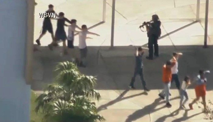 Police evacuate students. (Source: WSVN/CNN)