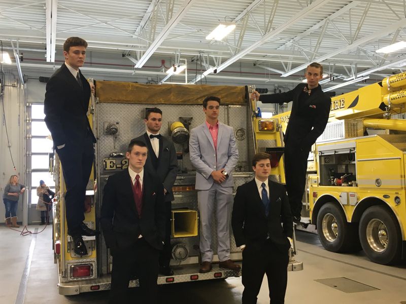 The students posed in their formal clothes on firetrucks and in the firehouse. (Source: Forest Lake Fire Department)