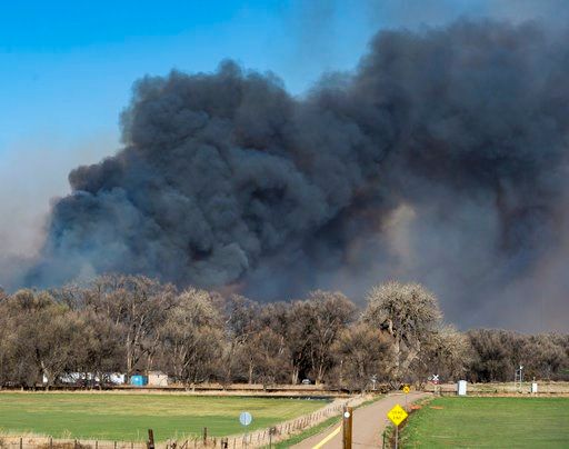 (Dougal Brownlie/The Gazette via AP). Wildfires burn in Southern El Paso County with one of them prompting mandatory evacuation orders, as seen from Hanover County on Tuesday April 17, 2018. Fire crews are fighting several new wind-swept wildfires arou...