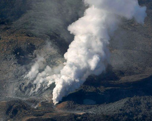(Kyodo News via AP). CORRECTS YAER - In this April 19, 2018, photo, volcanic smoke billows from Mt. Io, part of the Kirishima mountain range on Japan’s southern main island of Kyushu, taken over Ebino city, Miyazaki prefecture. The Meteorological Agenc...