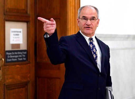 (Jessica Kourkounis/Pool Photo via AP). Defense witness Douglas Moss arrives to testify in actor and comedian Bill Cosby's his sexual assault retrial at the Montgomery County Courthouse in Norristown, Pa., Monday, April 23, 2018.