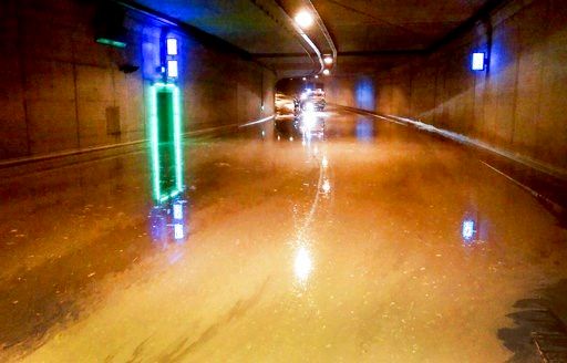 (Ralf Roeger/dpa via AP). In this April 29, 2018 photo the Euro tunnel in Aachen, Germany, is flooded. Firefighters are pumping floodwater from basements and clearing flooded roads after a storm swept through parts of western Germany overnight. The Aac...