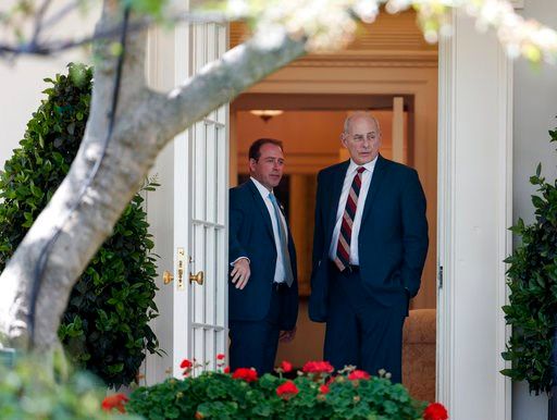 (AP Photo/Carolyn Kaster). Director of Oval Office Operations Jordan Karem, left, and White House Chief of Staff John Kelly stand in the door of the Oval Office before a news conference with President Donald Trump and Nigerian President Muhammadu Buhar...