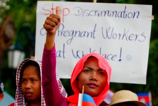 (AP Photo/Heng Sinith). A Cambodian worker attends a gathering to mark May Day at Tonle Sap river bank, in Phnom Penh, Cambodia, Tuesday, May 1, 2018. Some hundreds of workers staged a rally, demanding a better working condition.