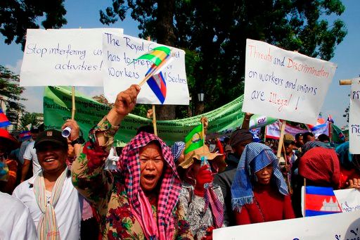 (AP Photo/Heng Sinith). Cambodian workers attend a gathering to mark May Day at Tonle Sap river bank, in Phnom Penh, Cambodia, Tuesday, May 1, 2018. Some hundreds of workers staged a rally demanded a better working condition.