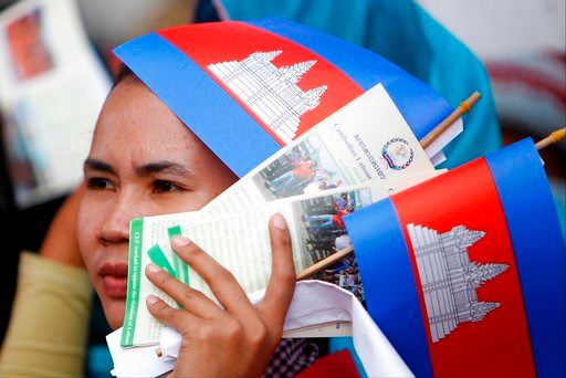 (AP Photo/Heng Sinith). A Cambodian worker participates during a gathering to mark May Day at Tonle Sap river bank, in Phnom Penh, Cambodia, Tuesday, May 1, 2018. Some hundreds of workers staged a rally, demanding a better working condition.