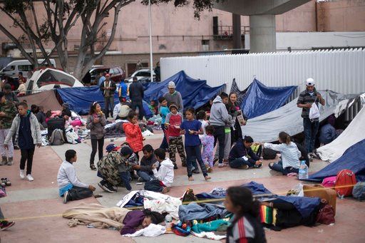 (AP Photo/Hans-Maximo Musielik). Migrants wait for access to request asylum in the US, at the El Chaparral port of Entry in Tijuana, Mexico, Monday, April 30, 2018.