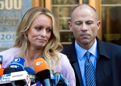 (AP Photo/Mary Altaffer, File). FILE - In this April 16, 2018, file photo, adult film actress Stormy Daniels, left, stands with her lawyer Michael Avenatti as she speaks outside federal court in New York. The story told by President Donald Trump and th...