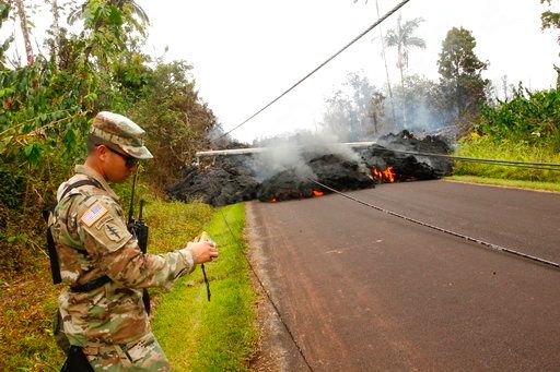 (Jamm Aquino/Honolulu Star-Advertiser via AP). Lava continues to overrun Hookupu Street, Monday, May 7, 2018, in Pahoa, Hawaii. Hawaii's Kilauea volcano has destroyed homes and spewed lava hundreds of feet into the air, leaving evacuated residents unsu...