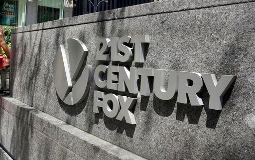 (AP Photo/Richard Drew, File). This Aug. 1, 2017, file photo shows the 21st Century Fox sign outside of the News Corporation headquarters building in New York.