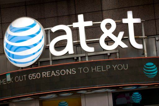 (AP Photo/Mark Lennihan, File). FILE - In this Monday, Oct. 24, 2016, file photo, the AT&amp;T logo is positioned above one of its retail stores, in New York.  The fate of the AT&amp;T-Time Warner merger, a massive media deal opposed by the government ...