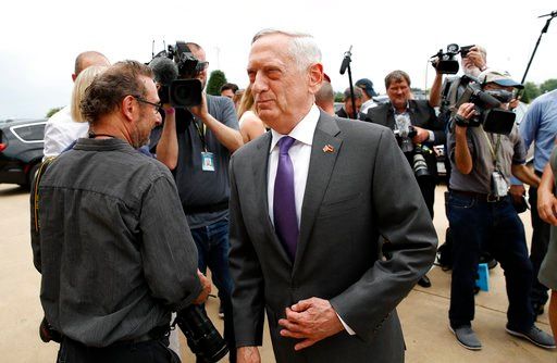 (AP Photo/Alex Brandon, File). In this Wednesday, June 20, 2018, file photo, U.S. Defense Secretary Jim Mattis, center, steps away after speaking with the media at the Pentagon. U.S. Defense Secretary Jim Mattis, who has accused China of "intimidation ...