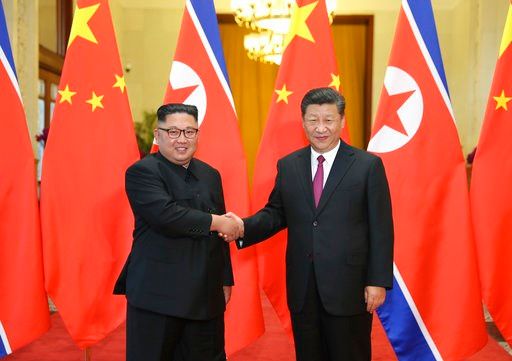 (Ju Peng/Xinhua via AP, File). FILE - In this June 19, 2018, file photo released by China's Xinhua News Agency, Chinese President Xi Jinping, right, poses with North Korean leader Kim Jong Un for a photo during a welcome ceremony at the Great Hall of t...