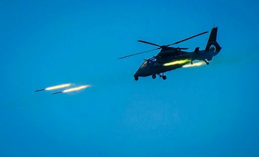 (Li Shilong/Xinhua via AP, File). FILE - In this April 18, 2018, file photo released by China's Xinhua News Agency, a Chinese armed helicopter assaults targets with rocket projectiles in a live-fire exercise off China's southeast coast. U.S. Defense Se...