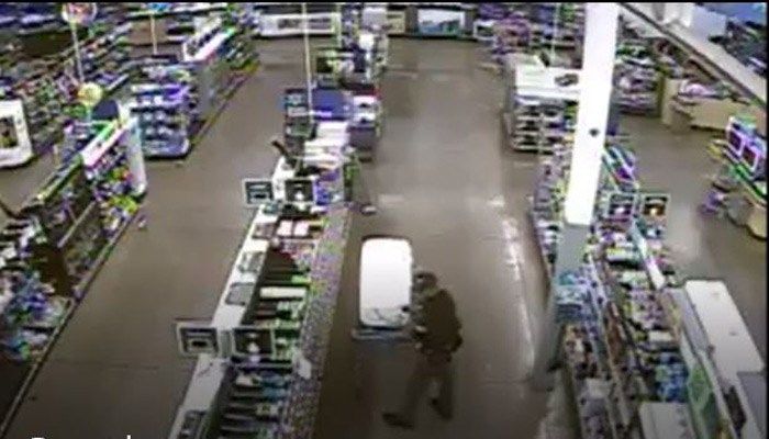 The man is seen on camera stuffing thousands of dollars of electronics into coolers. (Source: Leon County Sheriff’s Office)