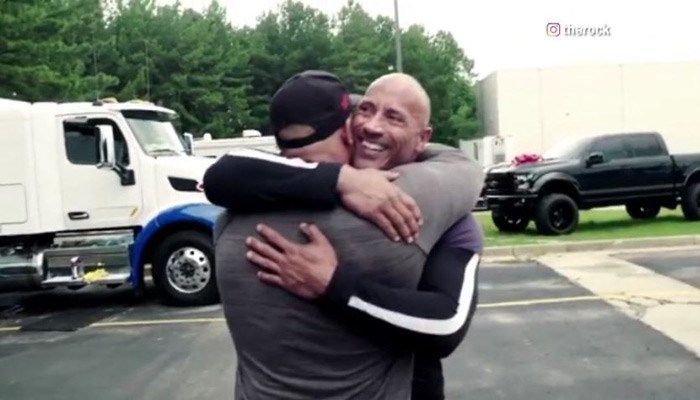 Johnson brought his cousin and stunt double Tanoai Reed to tears by gifting him a new truck. (Source: Instagram/@therock/CNN)