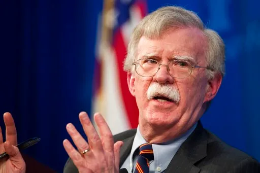 (AP Photo/Cliff Owen). FILE - In this Dec. 13, 2018 file photo, National Security Advisor John Bolton unveils the Trump Administration's Africa Strategy at the Heritage Foundation in Washington.  The White House has sent Bolton on a mission to allay Is...