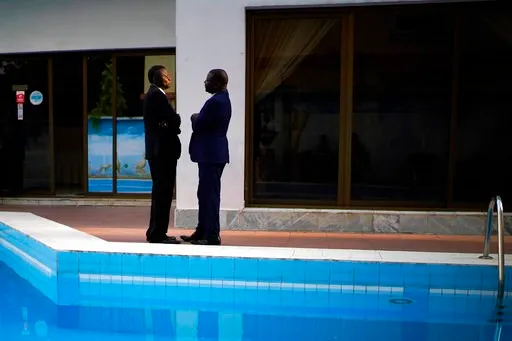 (AP Photo/Jerome Delay). Members of the Congolese opposition coalition Lamuka, led by presidential candidate Martin Faluyu, have a conversation while waiting for a statement to be issued on the timing of the release of the presidential election results...