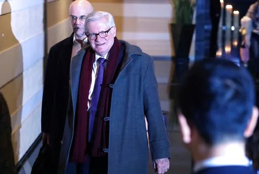 (AP Photo/Ng Han Guan). In this Sunday, Jan. 6, 2019, photo, U.S. Undersecretary of Commerce for International Trade Gilbert B. Kaplan leaves a hotel in Beijing. A U.S. delegation led by deputy U.S. trade representative, Jeffrey D. Gerrish arrived in t...