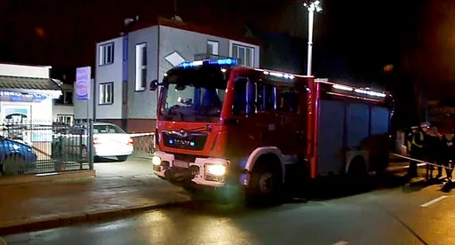 (AP Photo/TVN News via AP). A fire engine stands outside an "Escape Room" game location in Koszalin, northern Poland, on Friday, Jan. 4, 2019. A fire broke out at the "Escape Room" game location, killing five teenage girls and injuring a man, authoriti...
