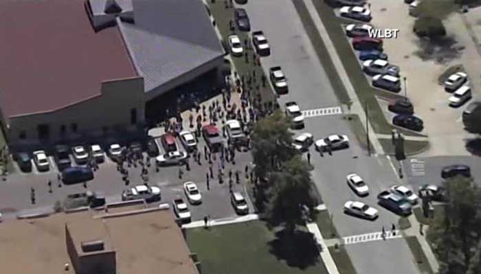 Police will ask you to raise your hands as they sweep a building for the shooter.  (Source: WLBT)