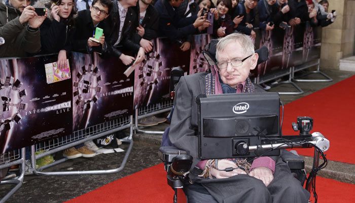 Stephen Hawking poses for photographers upon arrival for the Interstellar Live show at the Royal Albert Hall in central London on March 30, 2015. (Photo by Joel Ryan/Invision/AP)